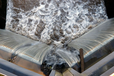 Close-up of water flowing over sea