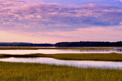 Scenic view of lake against sky during sunset