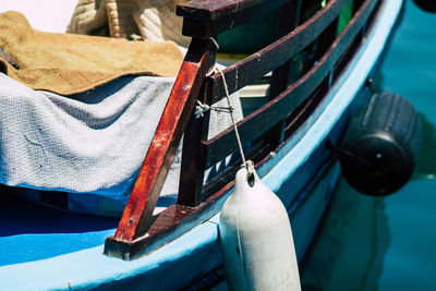 Close-up of fishing boat moored in sea