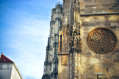 Low angle view of ornate building against sky