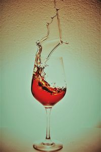 Close-up of wine in glass on table