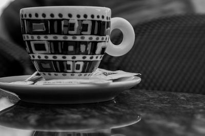 Close-up of coffee cup on table