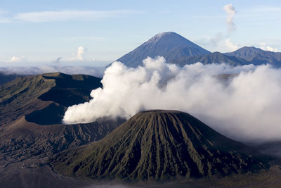 Smoke emitting from volcanic mountain