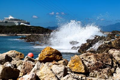 Scenic view of sea against blue sky