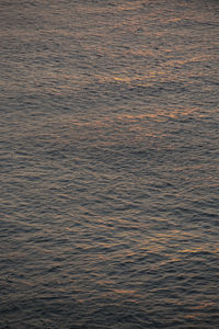 High angle view of rippled sea at sunset