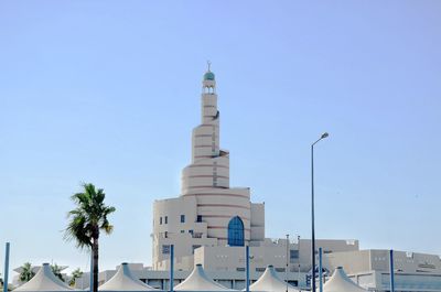 Low angle view of building against clear blue sky