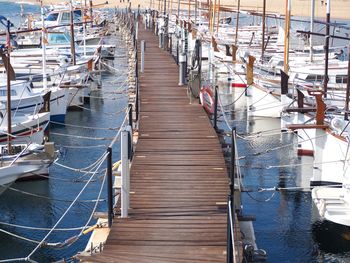 High angle view of sailboats moored in harbor