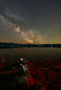 Scenic view of sea against sky at night