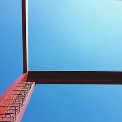 Low angle view of building against clear blue sky