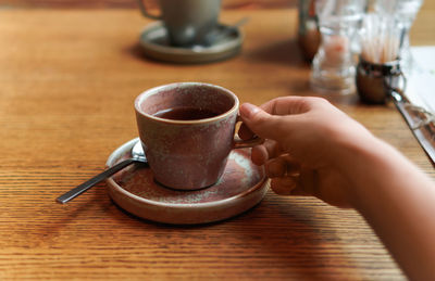 Close-up of coffee cup on table