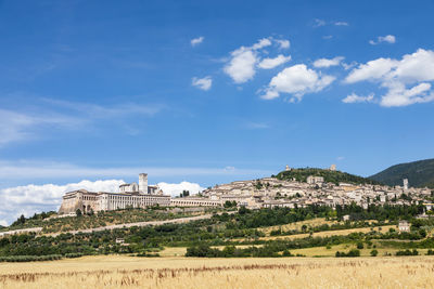 Built structure on landscape against sky