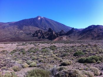 View of volcanic landscape against clear sky