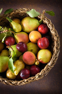 Directly above shot of fruits in basket on table