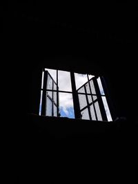 Low angle view of silhouette window in abandoned building