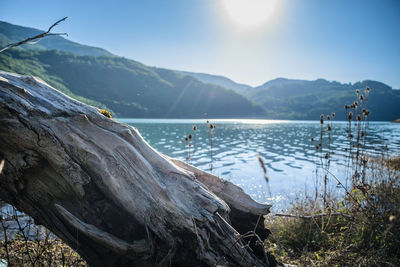 Scenic view of lake and mountains against sky