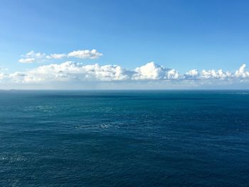 Scenic view of blue sea horizon against blue sky