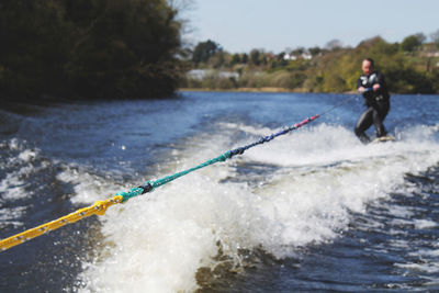 Man wakeboarding on sea