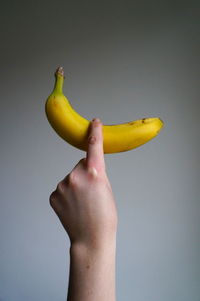 Close-up of cropped hands over white background