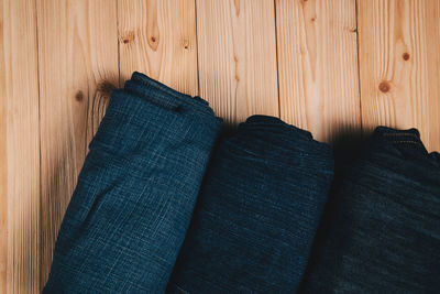 Directly above shot of rolled textiles on table