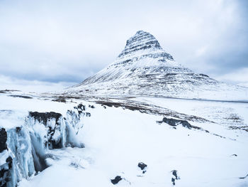 Scenic view of snow covered mountain against sky