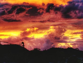 Low angle view of dramatic sky during sunset