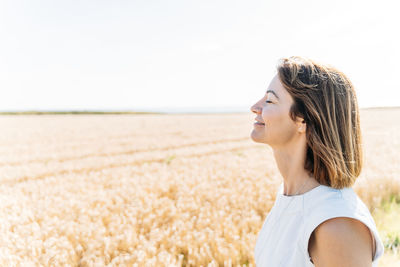 Summer concept, caucasian middle-aged woman in the countryside