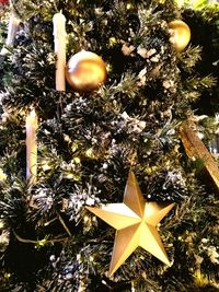 Close-up of illuminated christmas tree at night