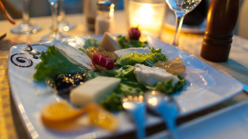 Close-up of christmas decorations on table at home