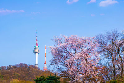 Low angle view of communications tower against sky