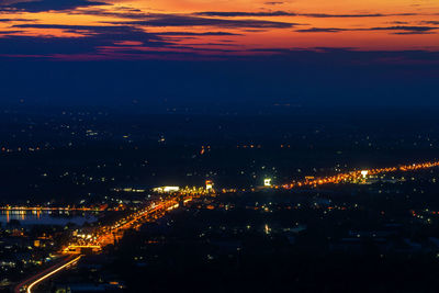 High angle view of illuminated city buildings at night