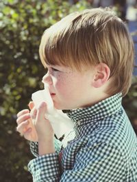 Close-up of boy eating food