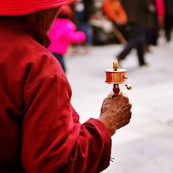 Rear view of a man holding temple