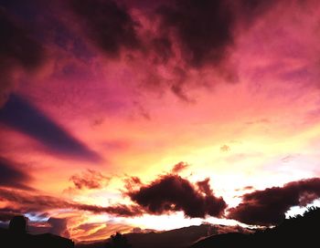 Low angle view of dramatic sky during sunset