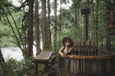 Young woman relaxing in hot tub