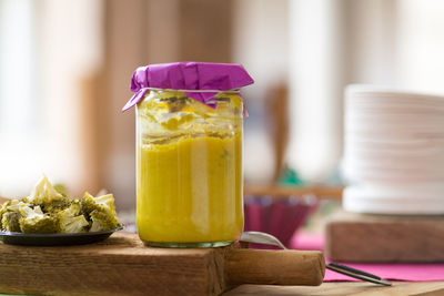 Close-up of food in jar on cutting board