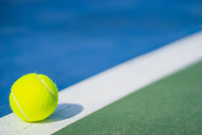 Close-up of tennis ball on field