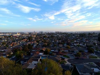 High angle view of cityscape against blue sky