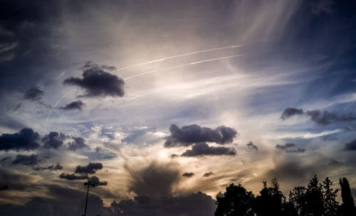 Low angle view of vapor trails in sky