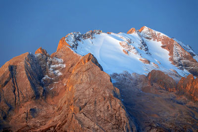 Scenic view of snowcapped mountains against clear sky