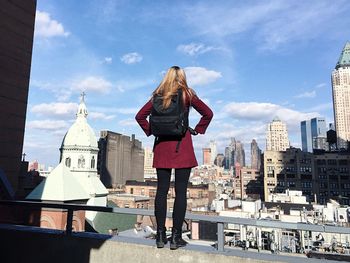 Woman standing on city street