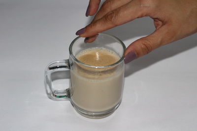 Close-up of hand holding drink