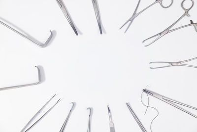 High angle view of cables on table against white background