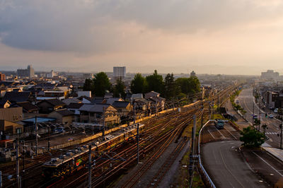 Train departing takaoka station in the evening