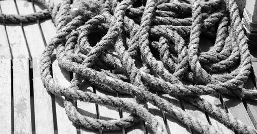 Close-up of rope tied on wood