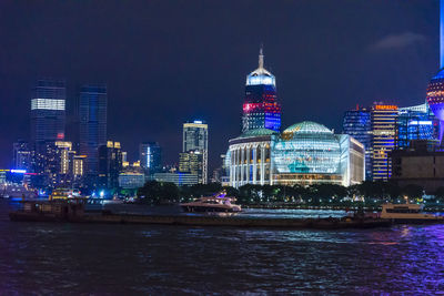 Illuminated buildings in city at night