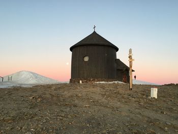 Old building against sky during sunset