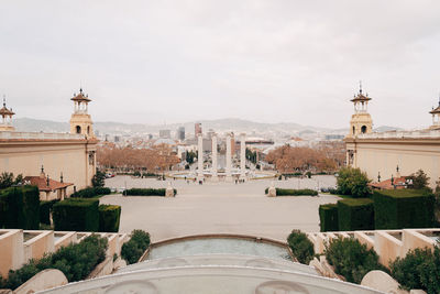 Panoramic view of buildings in city against sky