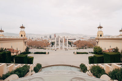 Panoramic view of buildings in city against sky