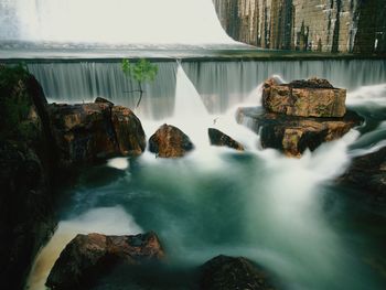 Stream flowing through rocks