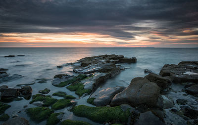 Scenic view of sea against sky during sunset